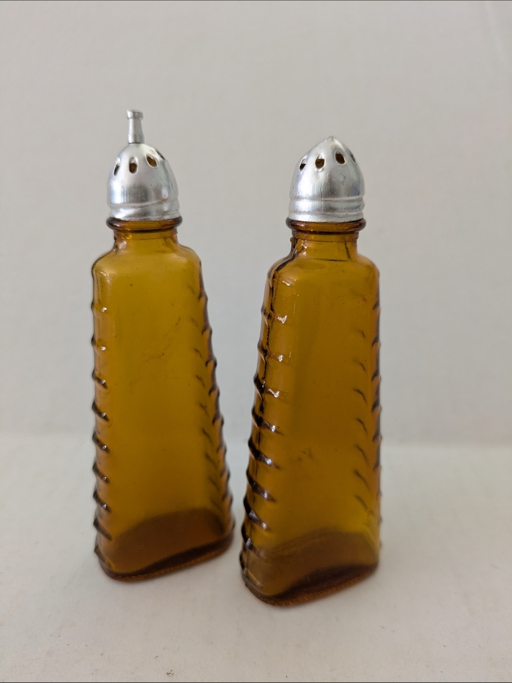 Amber Glass Salt and Pepper Shakers with Silver Tops. Made In Taiwan
